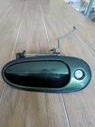 Dark Green Left Driver Side Exterior Front Door Handle Gm 22615195 Used. Price: $12.35.